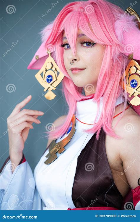 Female Cosplayer in a Pink Anime Costume Wearing Pink Hair Stock Image - Image of cosplayer ...