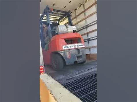 sketchy loading penske truck using a ramp and forklift, no dock. - YouTube