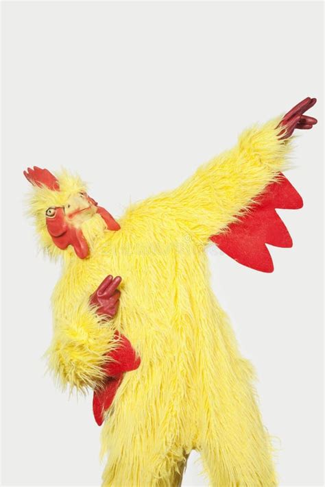 Playful Young Man In Chicken Suit Against Gray Background Stock Image - Image of leisure, people ...