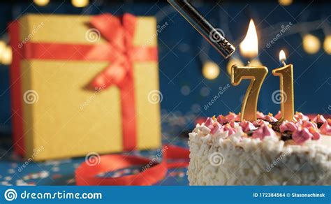 White Birthday Cake Number 71 Golden Candles Burning By Lighter, Blue Background With Lights And ...