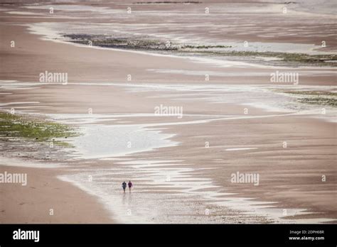 Aerial View Of People Walking At Beach Stock Photo - Alamy