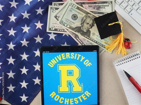 In this photo illustration, University of Rochester logo seen displayed on a tablet. Stock Photo ...