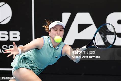 Lulu Sun of Switzerland plays a shot in her match against McCartney ...