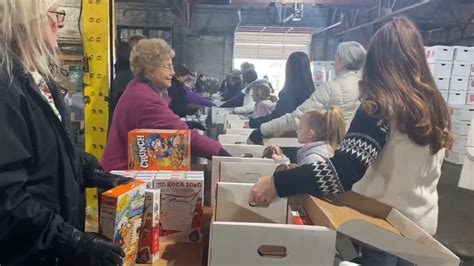 Salvation Army volunteers pack Christmas baskets for families