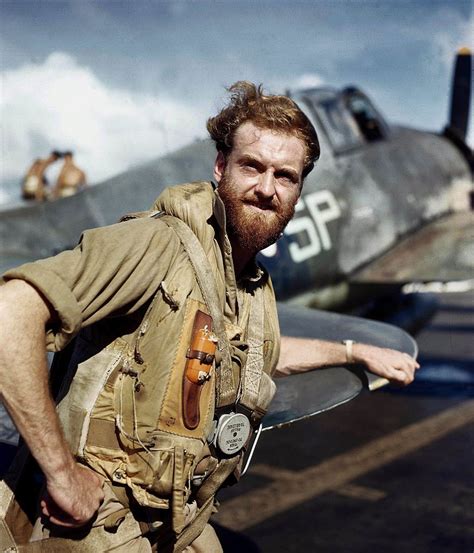 Pilot of the Fleet Air Arm, Royal Navy, with his Hellcat fighter in the Far East, 1944 : r ...