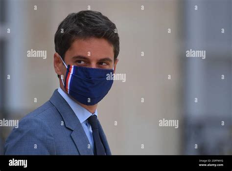 French government spokesman Gabriel Attal leaves the Elysee palace after the weekly cabinet ...