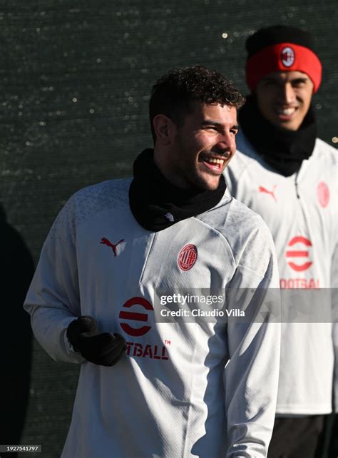 Theo Hernandez of AC Milan smiles during a AC Milan training session ...