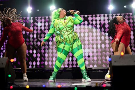 Lizzo Became the Grinch With Green Hair, a Striped Bodysuit, and a ...