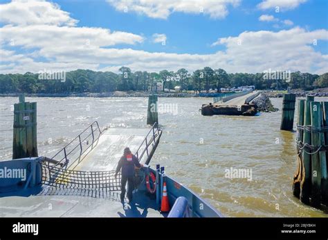 A worker prepares the Mobile Bay Ferry to dock at the Fort Morgan ferry landing, March 4, 2016 ...