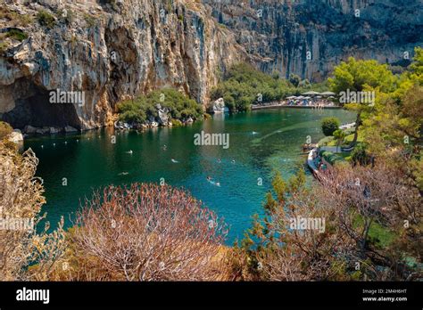 Vouliagmeni, Greece - September 1, 2022: Some people enjoy the good weather of a summer day on ...