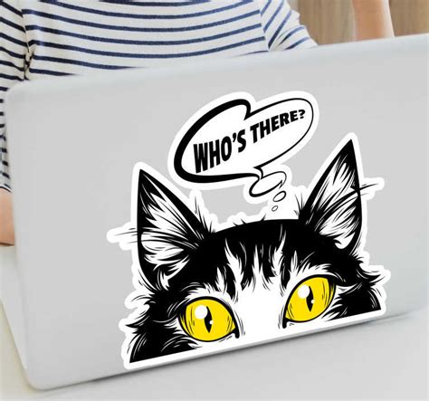 cat piking out laptop skin - TenStickers