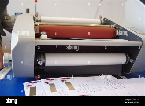 Plastic laminating machine Stock Photo - Alamy