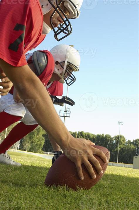 Center with Football and Offensive Tackle 1061543 Stock Photo at Vecteezy