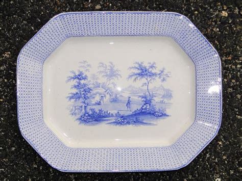 a blue and white plate sitting on top of a counter