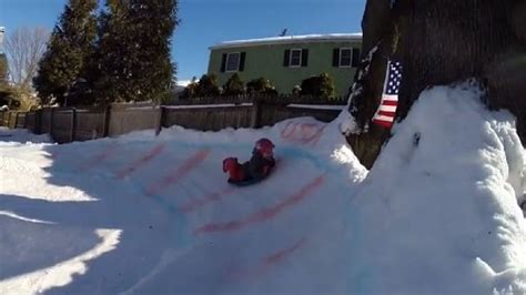 Dad creates backyard luge track for neighborhood kids