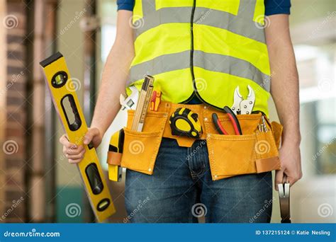 Detail of Construction Worker on Building Site Wearing Tool Belt Stock ...