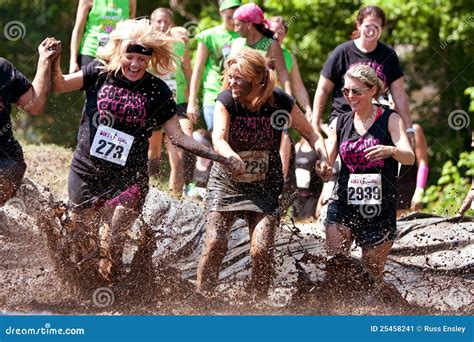 Women Run And Splash Through Mud Pit Editorial Photo | CartoonDealer ...