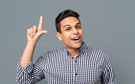 Handsome Guy Pointing Finger Upwards on Gray Background. Stock Photo - Image of millennial ...