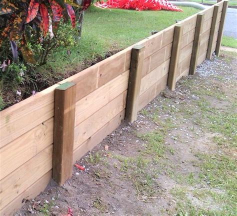 How to Build a Wood Retaining Wall | Landscaping retaining walls, Garden retaining wall ...