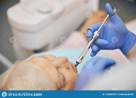 Dentist Making Injection of Anesthetic To Patient Stock Image - Image ...