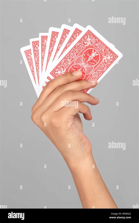 Close up of a person hand playing cards Stock Photo - Alamy