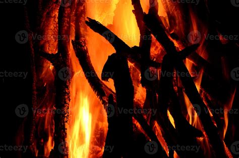 Close up of burning logs in the fireplace on black background 2859042 Stock Photo at Vecteezy