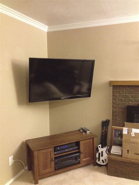 Corner mounted TV with the wires hidden adds so much space in your ...