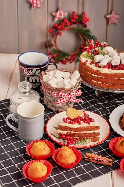 Premium Photo | Christmas table decoration, festive fruitcake with sweets on the table