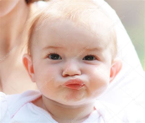 Beautiful baby making face — Stock Photo © lenanet #26084399