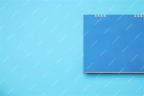 Premium Photo | Empty blank calendar on blue background