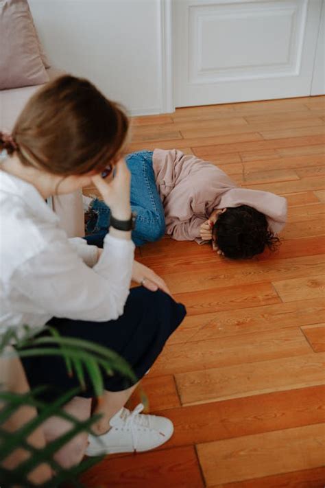 Young Woman Crying on Floor · Free Stock Photo