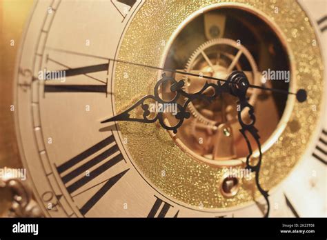 A gold vintage clock hands Stock Photo - Alamy