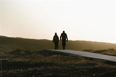 "Silhouette Of Two People Walking Away In To The Distance At Sunset." by Stocksy Contributor ...