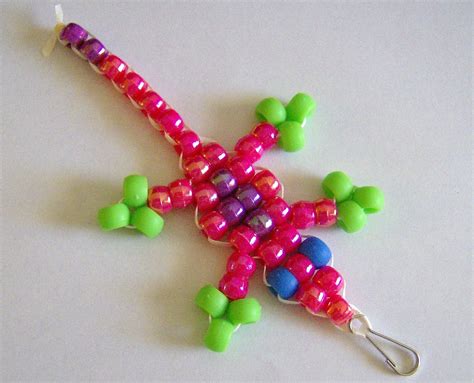 a colorful beaded star ornament on a white surface