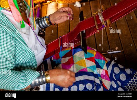 A Senior Woman From The Kayan (Long Neck) Ethnic Group Weaving Fabric, Lake Inle, Shan State ...