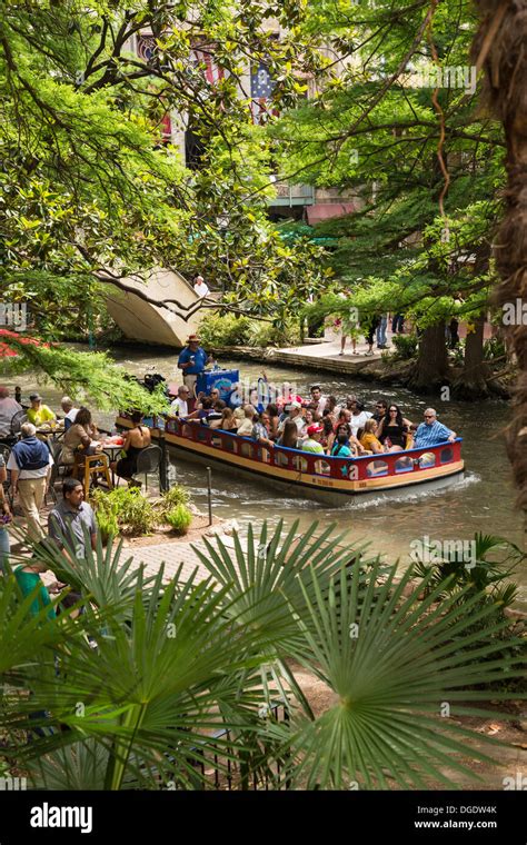 Tourists taking a boat ride along the San Antonio Riverwalk Texas USA ...