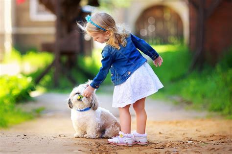 Child's Love - Cute Little Girl Playing With Puppy - Baby Posters | OshiPrint.in