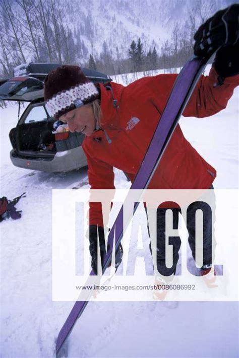 Professional telemark skier Kasha Rigby puts skins on her skis before going skiing in the