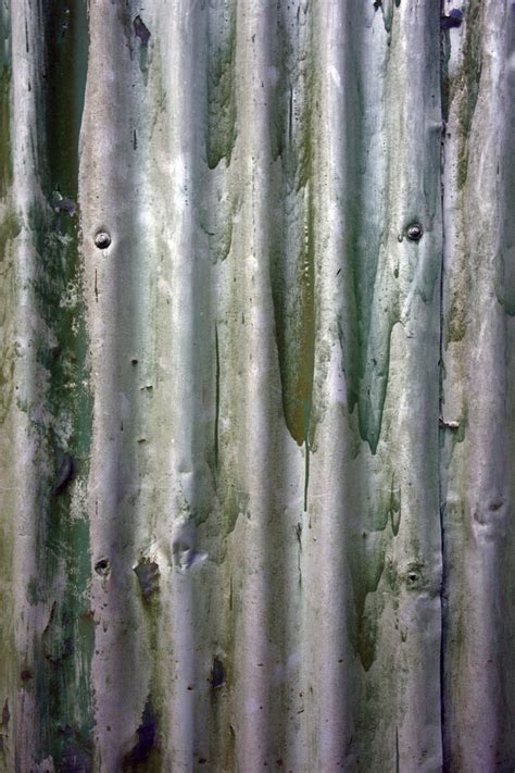 old corrugated iron background texture with green paint