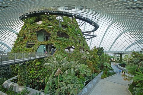 the inside of a building with plants growing on it's walls and walkways