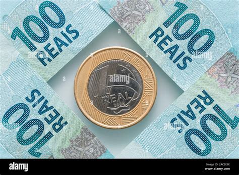 Brazilian Real coin and 100 Reais banknotes Stock Photo - Alamy