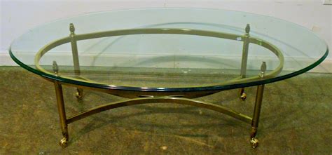 30 Collection of Oval Glass and Wood Coffee Tables
