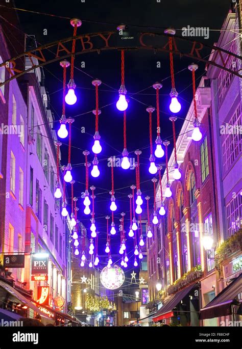 Magenta Christmas lights in Carnaby Street London Stock Photo - Alamy