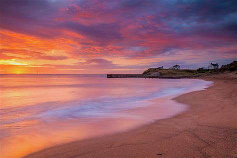 Sunrise at Seaton Sluice. Photograph by John Cox - Fine Art America