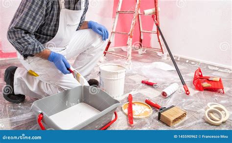 House Painter Worker at Work in the Construction Site. Building Stock Photo - Image of ...