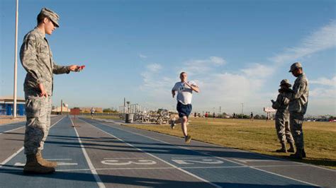 The U.S. Air Force demonstrates the proper way to perform exercises and ...