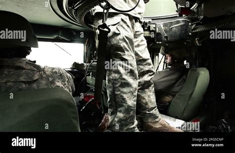 Shot of soldiers in a Humvee including the turret gunner Stock Video Footage - Alamy