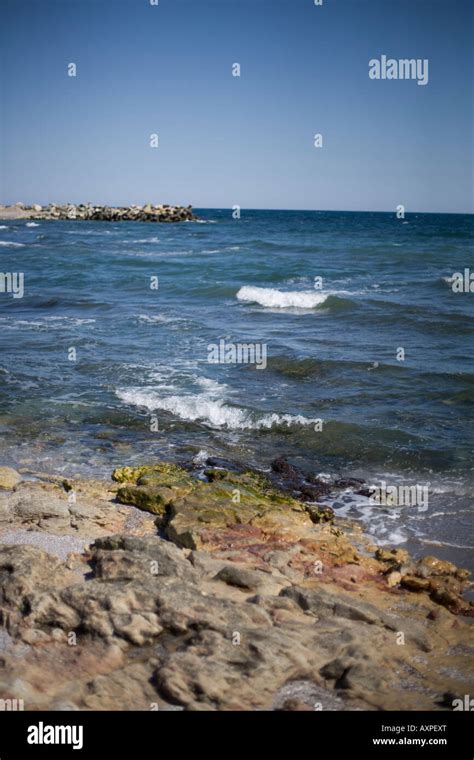 sea shore with rocks Stock Photo - Alamy