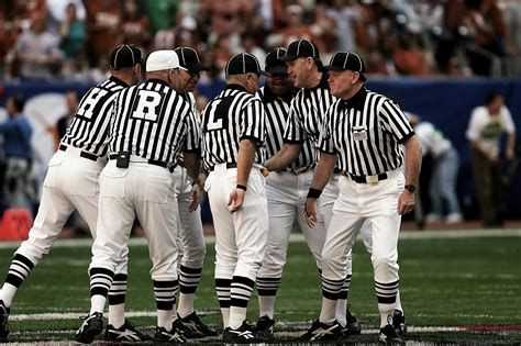 8 Football Referees in the Field · Free Stock Photo
