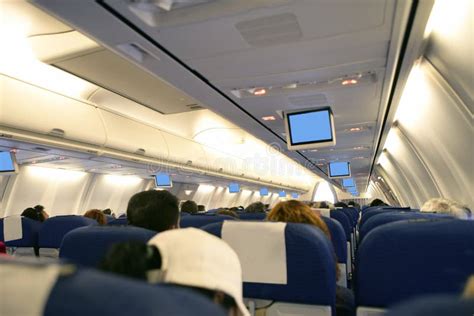 Airplane with Passengers Interior View Stock Image - Image of board ...